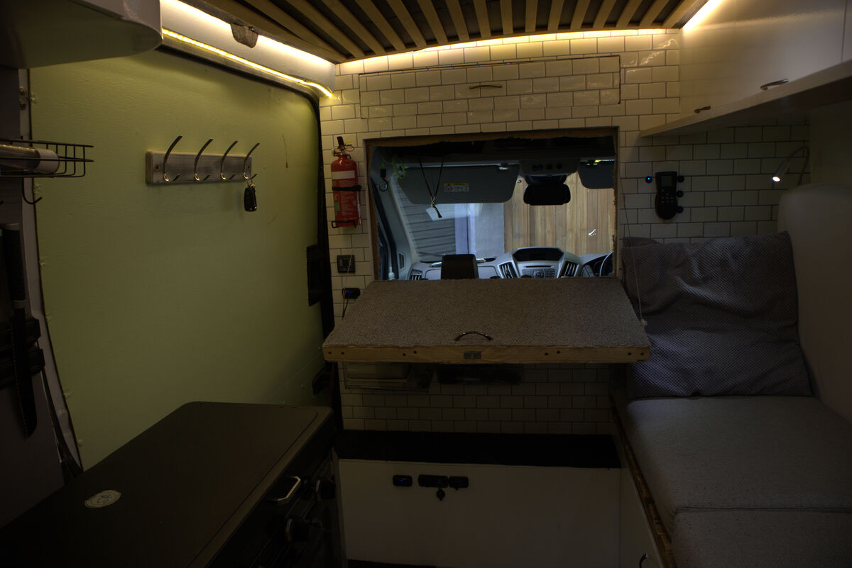 Drop-down shelf accessible from the cockpit